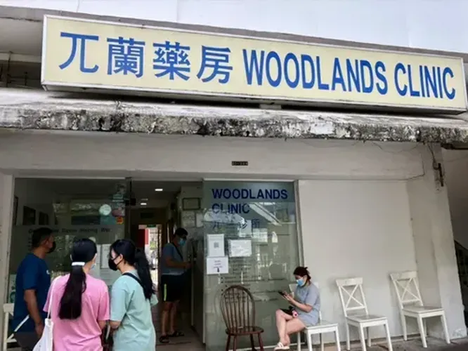 WOODLANDS CLINIC logo